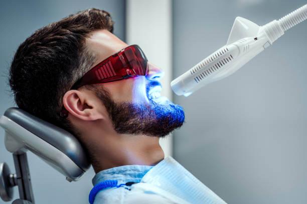 a person receiving teeth whitening 